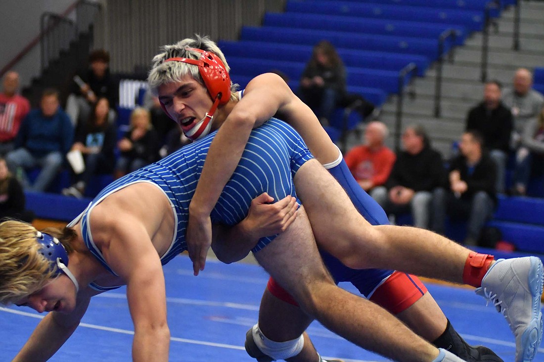 Jay County High School senior Tony Wood completes a double-leg takedown to score against Centerville’s Kale Creech in the 138-pound match Tuesday. Wood was meticulous with his offense, focusing on his technique before pinning Creech 20 seconds into the second period. (The Commercial Review/Andrew Balko)