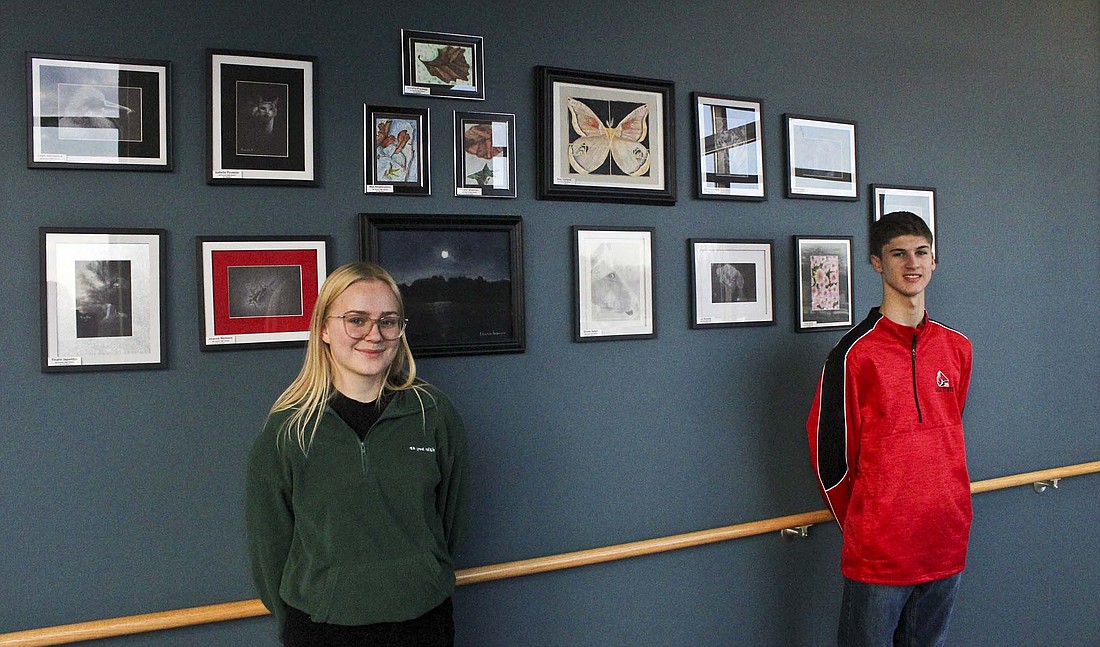 Isabella Puusepp and Zander Hudson are two of 13 Jay County High School students who have their artwork on display at IU Health Jay in Portland. The opportunity for student art to be displayed at the hospital grew out of an idea from nurse Lisa Manor to offer the space to IU Health Jay employees. (The Commercial Review/Ray Cooney)