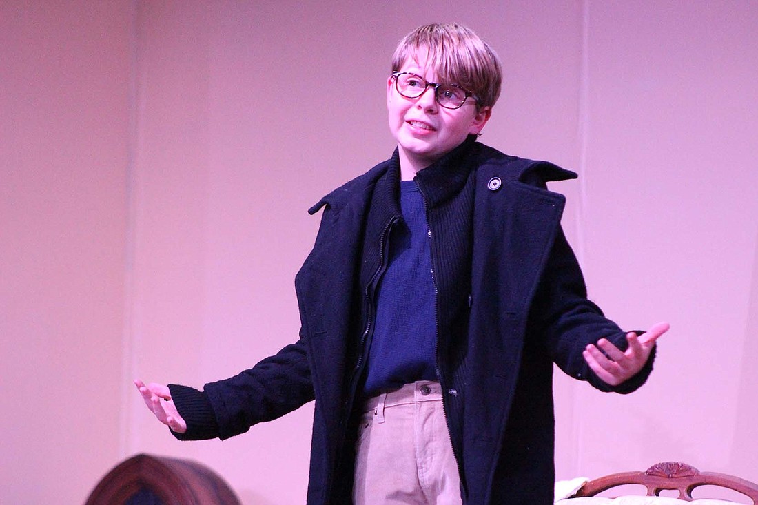 Cam LeFevre of Fort Recovery gestures during Tuesday evening’s rehearsal for Jay County Civic Theatre’s production of the musical, “A Christmas Story.” LeFevre plays Ralphie, who is on a quest to receive a Red Ryder BB gun for Christmas. The show opens at 7 p.m. tonight, with additional performances at 7 p.m. Friday and Saturday. Other shows are set for 7 p.m. Dec. 15 and 16, and 2 p.m. Dec. 17. (The Commercial Review/Bailey Cline)