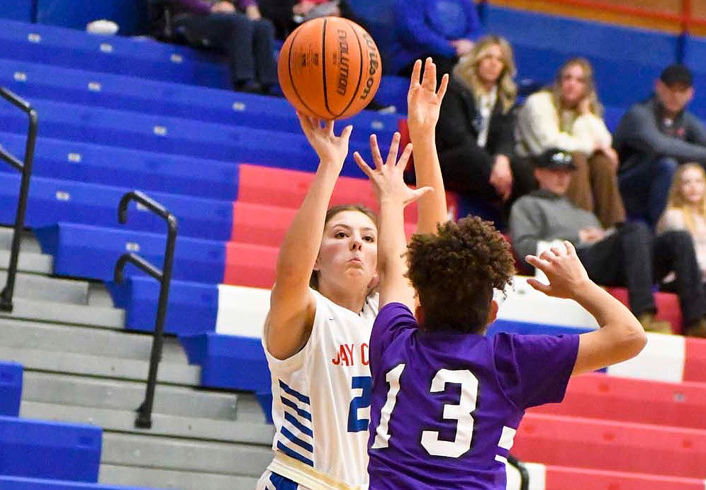 Alexis Sibray of the Jay County High School girls basketball team hoists a 3-pointer in Tuesday’s 64-13 win over Muncie Central. While the shot didn’t fall off Sibray, the sophomore scored her first points of the season on a fast break early in the fourth quarter. (The Commercial Review/Andrew Balko)