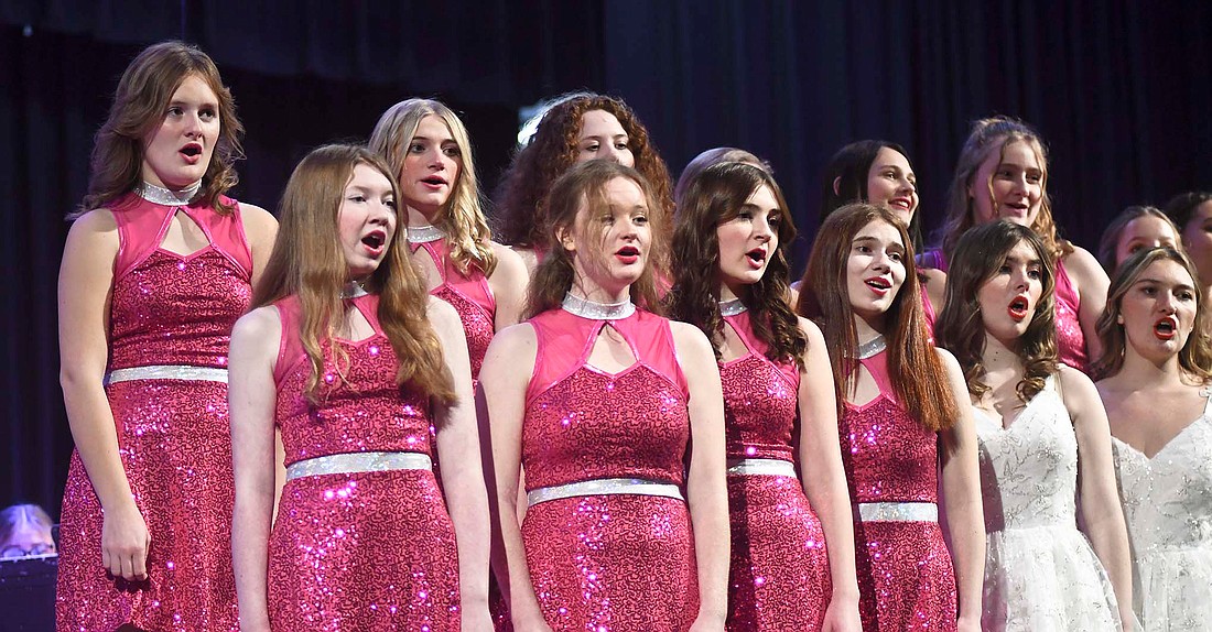 Members of the Jay County High School choir sing Sunday during the music department’s Christmas concert. The choir and band closed the concert together with a performance of “Christmas Finale.” Pictured, front row from left, are Cara DeRome, Jazilyn Braden, Kylee Daniels, Carlene Shaneyfelt and Inara Sanderson. Back row are Kadence Allred, Kaylynn Clark, Maley Recker, Kaileigh Compton and Allie McAbee. (The Commercial Review/Ray Cooney)
