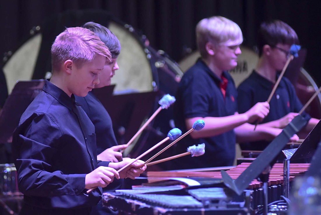 Seventh grader Cooper Wright plays the marimba Tuesday evening during the Jay County Junior High School band’s Christmas concert. The concert included songs performed by the seventh grade, eighth grade and combined bands. (The Commercial Review/Ray Cooney)