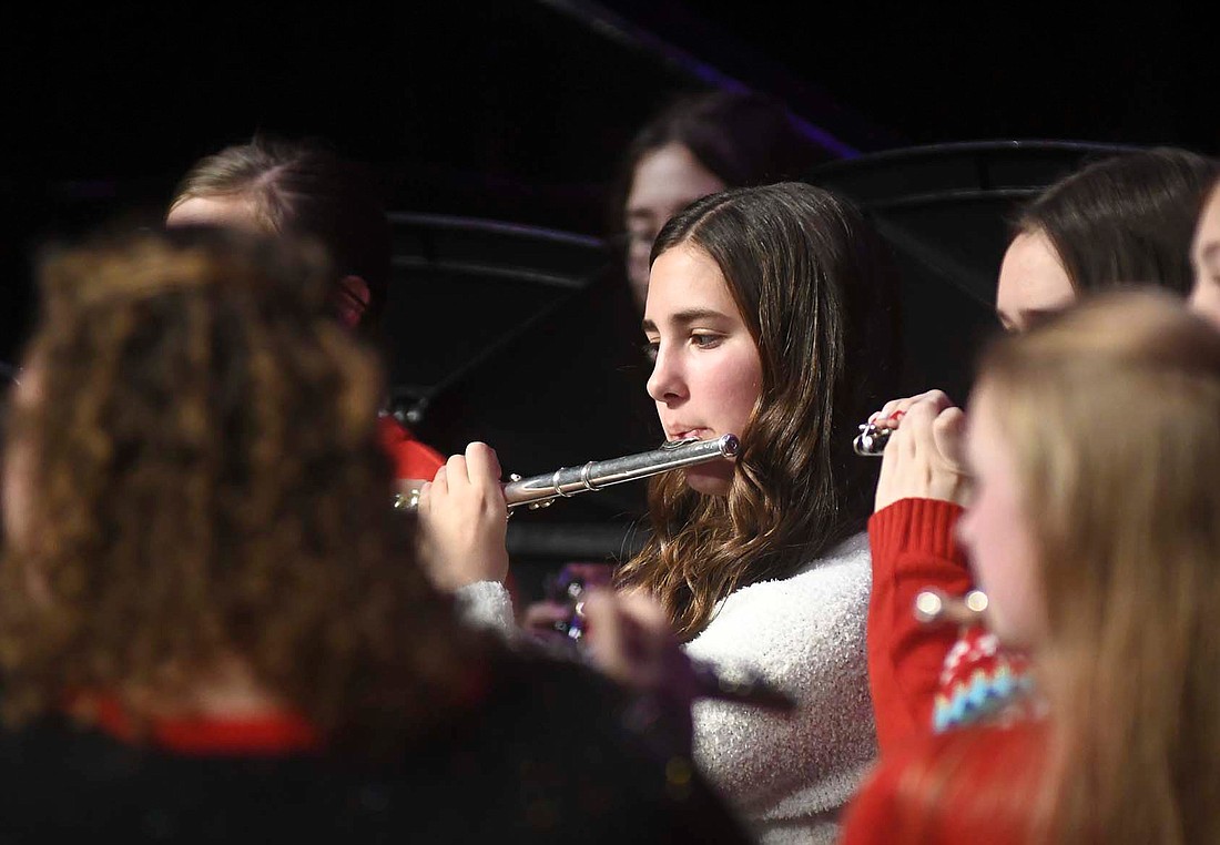 Maddie Schoenlein, a freshman, plays the flute Sunday evening during the Fort Recovery Local Schools band concert. The high school band’s selection of songs included a version of “Ave Maria” by German composer Franz Biebl. (The Commercial Review/Ray Cooney)