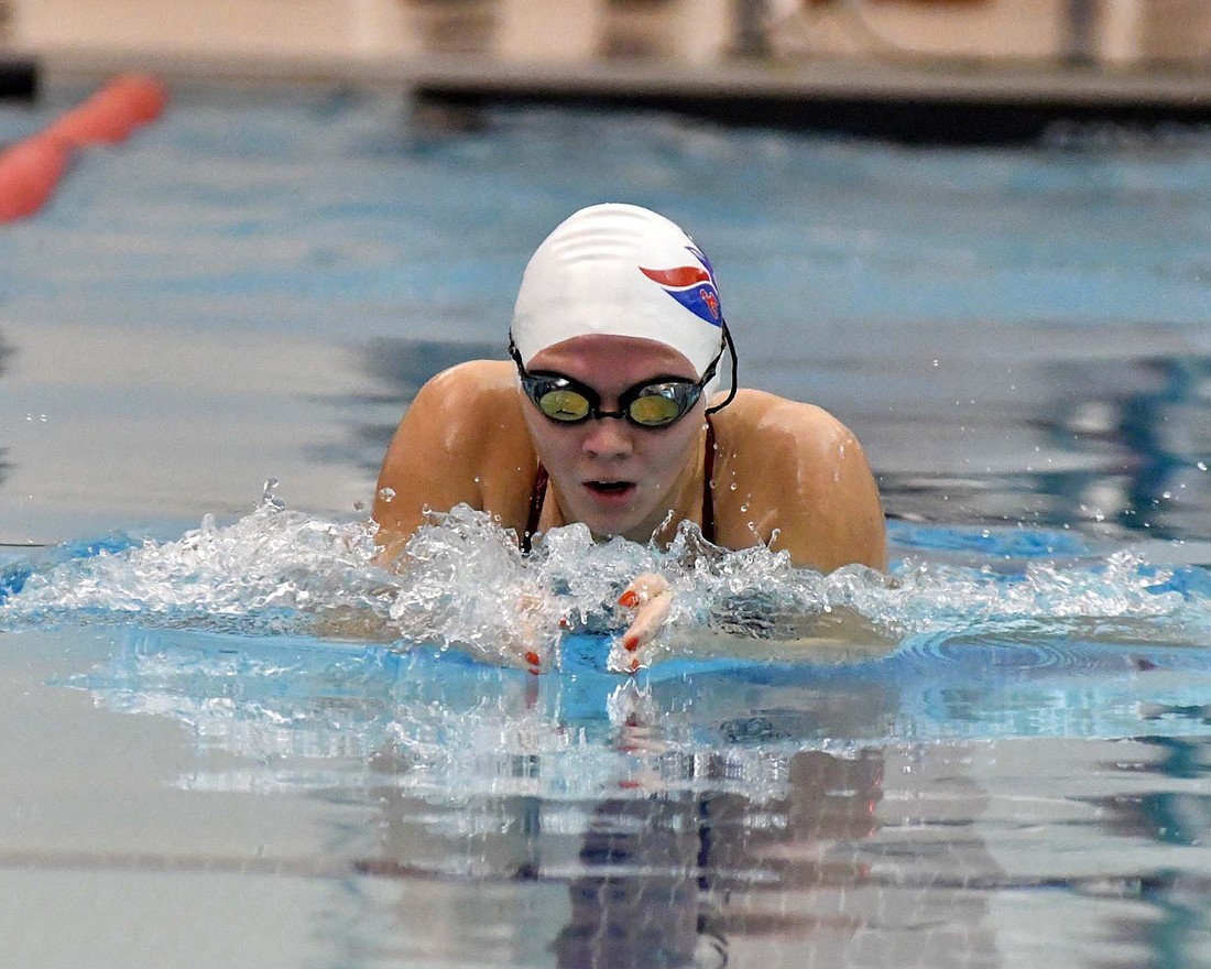 Morgan DeHoff of Jay County High School swims in the 100-yard breaststroke in the meet at Adams Central on Monday. DeHoff missed first place by 0.03 seconds, but the girls still pulled out the win over the Jets. (The Commercial Review/Andrew Balko)