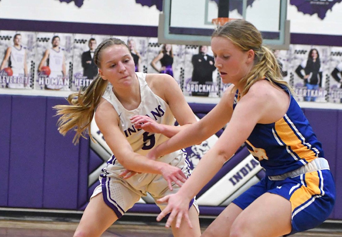 Cali Wendel of Fort Recovery High School feeds the post in the Indians’ 34-31 loss against St. Marys Memorial on Tuesday. FRHS outscored the Roughriders 24-10 in the paint. (The Commercial Review/Andrew Balko)