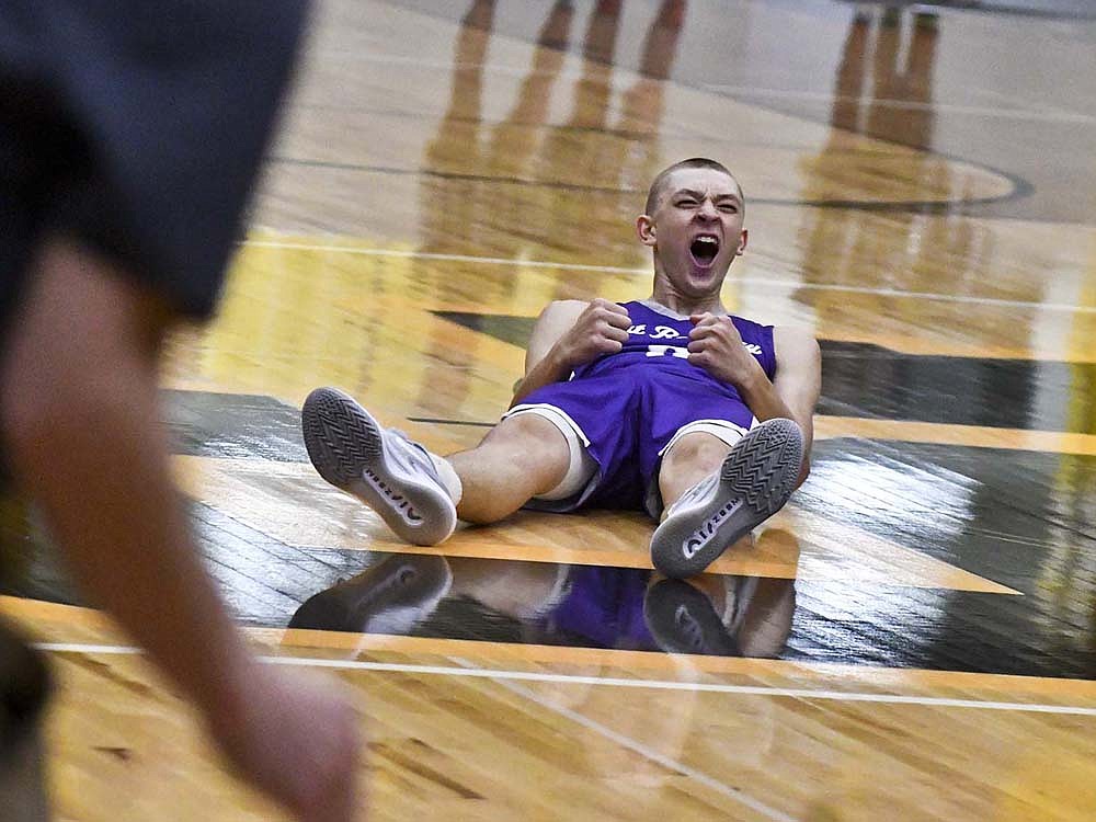 Briggs Overman, a Fort Recovery High School junior, reacts after hitting the game-winning buzzer-beater Friday night as the Indians fought off the host South Adams Starfires 39-37. (The Commercial Review/Andrew Balko)