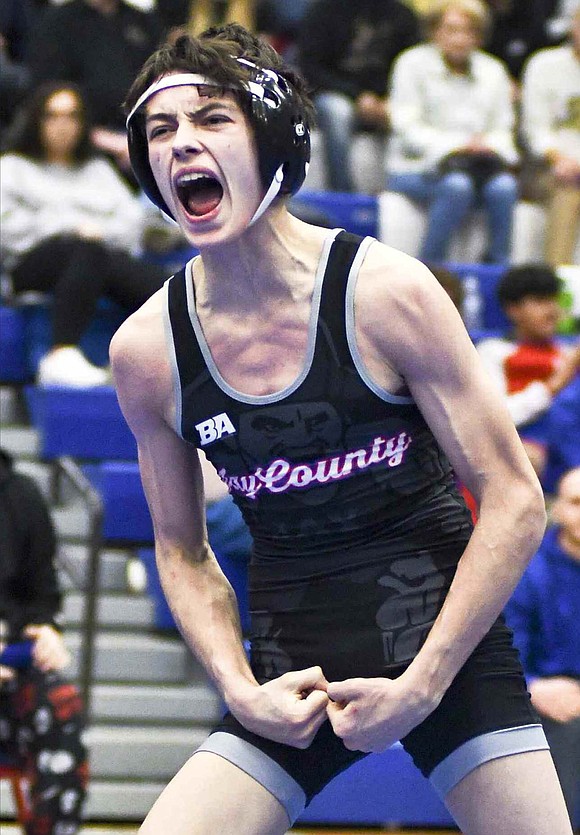 Senior Daniel Moore of Jay County High School flexes after winning the 113-pound sectional championship. He and his fellow Patriots won the team sectional title for the first time since 2018. (The Commercial Review/Ray Cooney)