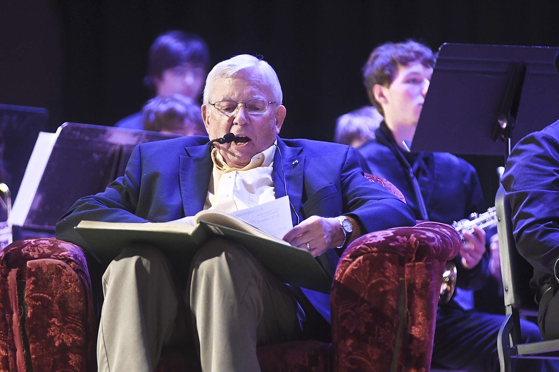 WPGW Radio’s Rob Weaver reads a version of “A Christmas Carol” as part of the Jay County High School concert band’s Christmas performance Dec. 10.	(The Commercial Review/Ray Cooney)