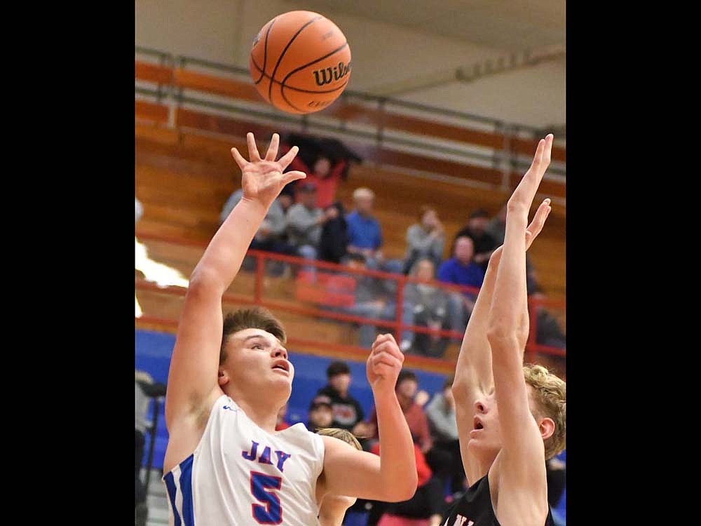 JCHS junior Levi Muhlenkamp floats up a shot during the PatriotsÕ 59-24 loss Saturday to the top-ranked Raiders of Wapahani. Jay County kept it close in the first quarter but lost control as 3-point shots started to fall. (The Commercial Review/Andrew Balko)