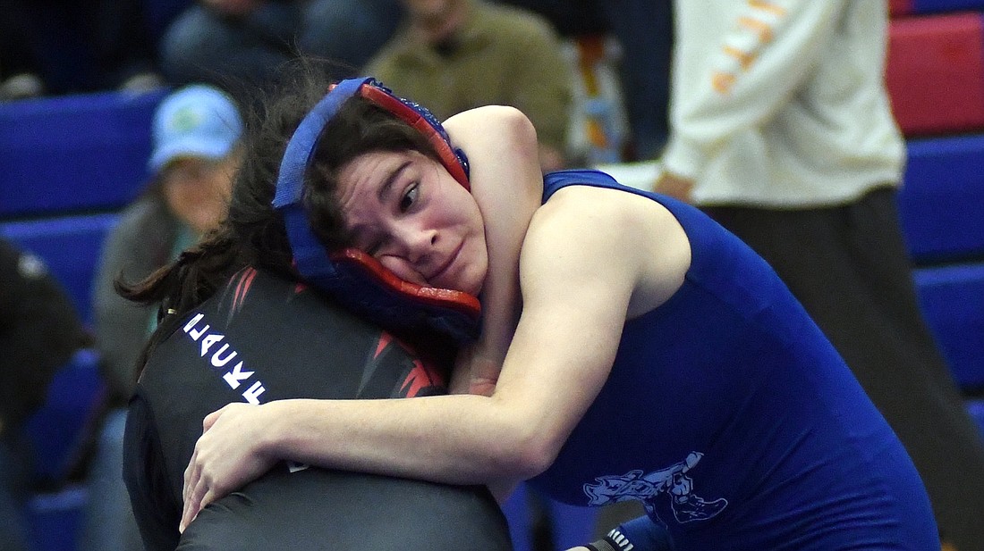 Jay County High School's Katie Rowles, who is ranked seventh in the state, powers through Madison Henderson of Blackford during their regional match Saturday. Rowles won the regional title at 100 pounds but got a tough draw in the semi-state. After a first-round bye, she'll meet sixth-ranked Angelina Clay of Lakeland in the quarterfinal with a state berth on the line. (The Commercial Review/Ray Cooney)