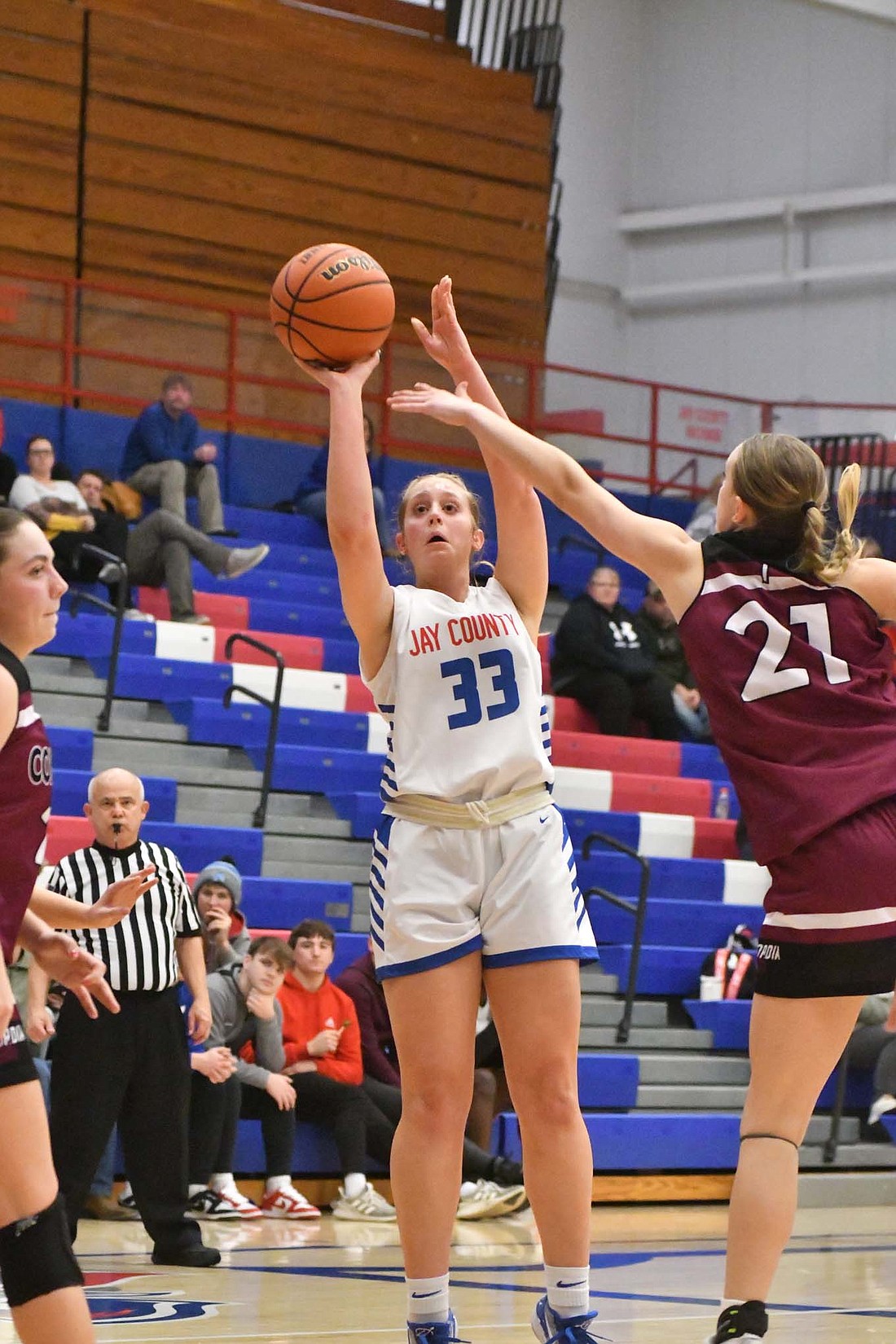 Jay County High School senior Danielle May fires up a jump shot late in the fourt quarter of a 59-37 win against Concodia Lutheran on Tuesday. The shot was the last made basket for the Patriots, and pushed May to eight points on the game. (The Commercial Review/Andrew Balko)