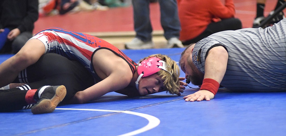 Jay County High School's Grant Linville holds down Jack Hunter of Western for a near fall as part of his 17-8 major decision victory in Saturday's third-place match during the Class 2A Indiana High School Wrestling Coaches Association team state duals. Linville also came up with a key pin for a win against Oak Hill in the quarterfinals. (The Commercial Review/Ray Cooney)