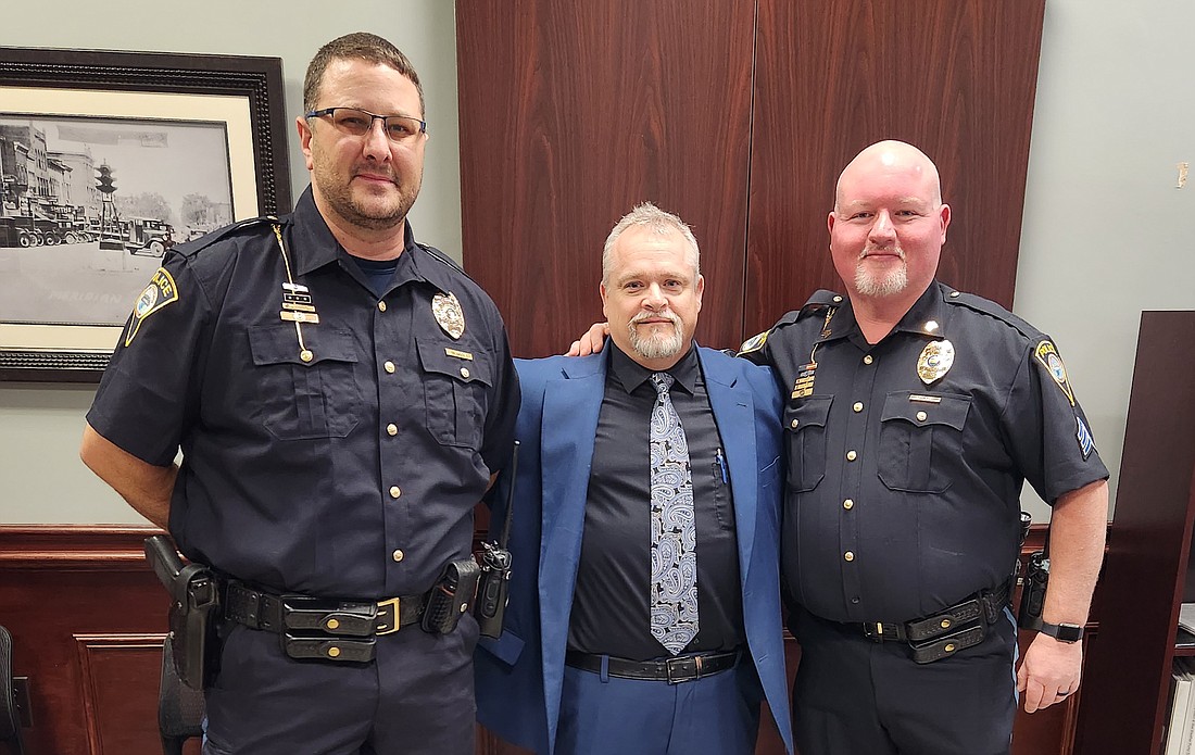 Portland Mayor Jeff Westlake recently appointed a new police chief and assistant chief. Pictured, Westlake (center) stands with police chief Dustin Mock (left) and assistant chief Donnie Miller after swearing them into their new roles. (Photo provided)