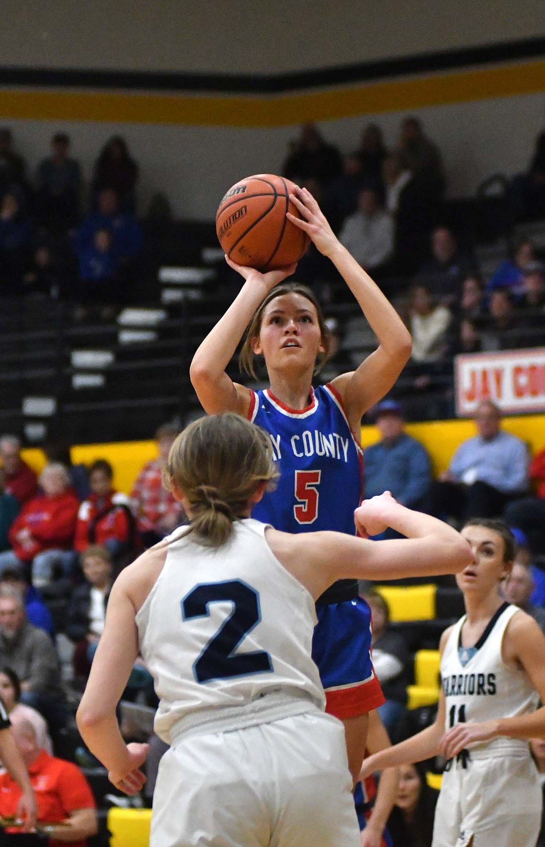 Molly Muhlenkamp of the Jay County High School basketball team fires up a shot during the Allen County Athletic Conference tournament championship on Saturday. The Patriots won the tournament for the fourth year in a row as they took out the Woodlan Warriors for the second time this season. (The Commercial Review/Andrew Balko)