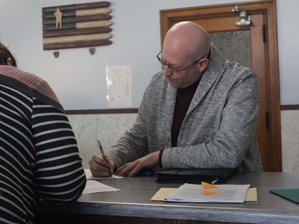 Blake Watson finishes up paperwork Wednesday afternoon to file to run for the south district Jay County Commissioners seat. Watson is the first Democrat to file to run for office in the county. (The Commercial Review/Ray Cooney)