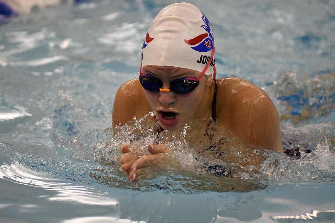 Jay County High School’s Lauren Fisher swims the breaststroke leg of the 200-yard medley relay Friday night during the Allen County Athletic Conference Championships. Maddy Snow won diving and Fisher was second in the 200 IM and the 100 butterfly to lead the Patriots to their seventh consecutive ACAC title. (The Commercial Review/Ray Cooney)