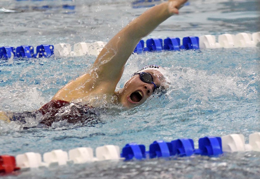 Jay County junior Aubrey Millspaugh swims the 100-yard freestyle during Tuesday's sweep of Blackford and Muncie Burris. Millspaugh's time of 1 minute, 3.46 seconds won the event to make her one of the 10 Patriot girls to win an event. (The Commercial Review/Andrew Balko