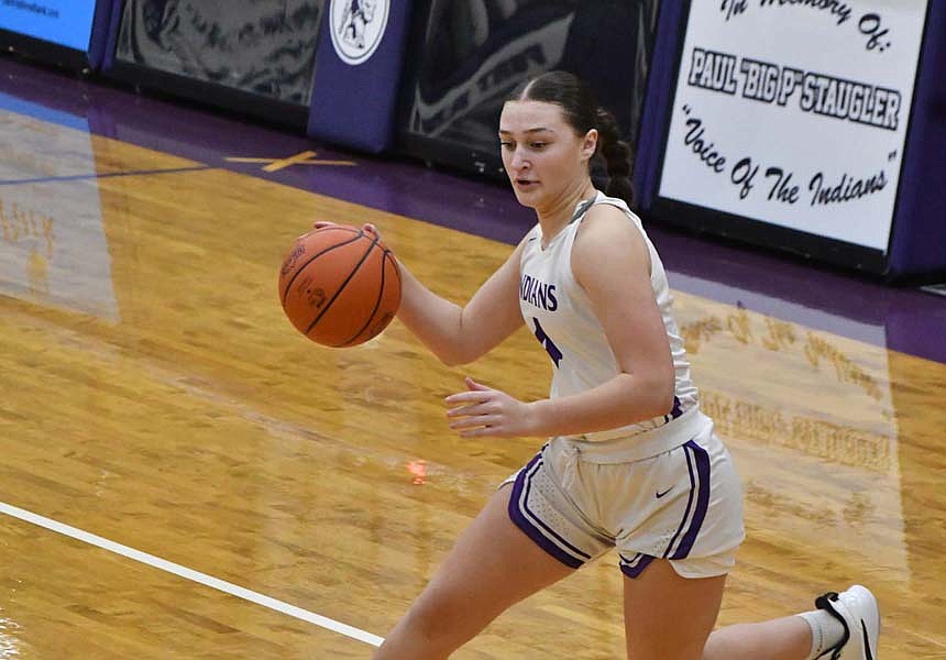 Fort Recovery High School freshman Sophia Guggenbiller drives to the middle of the floor in the first half of Thursday’s 36-29 loss to Marion Local. (The Commercial Review/Andrew Balko)