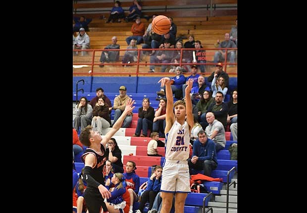 Jay County High School senior Trevin Dunnington pulls a 3-pointer from the corner on Saturday’s 56-43 win over Blackford. Dunnington had eight points in the game that the Patriots pushed their winning streak to four as they inch back towards .500.