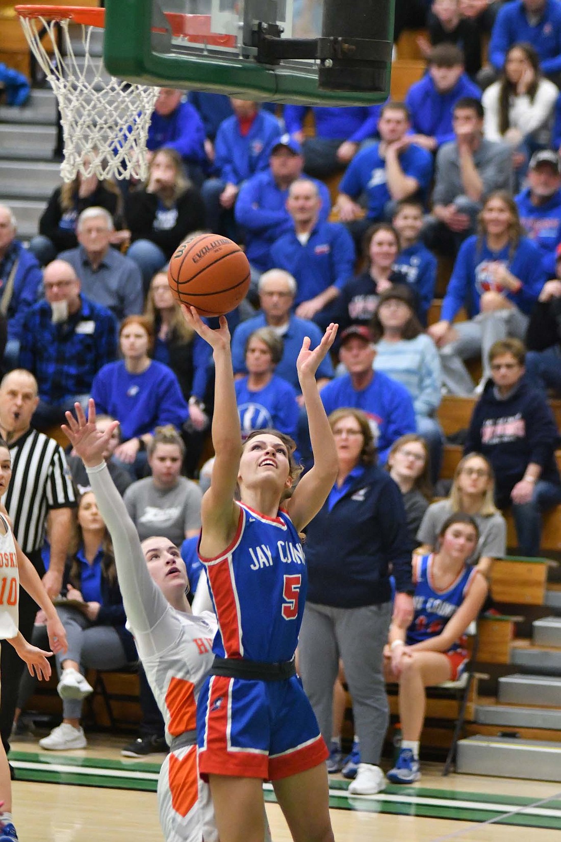 Jay County High School’s Molly Muhlenkamp glides up for a layup while getting fouled by No.1 Hamilton Height’s Katie Brown in the third quarter of the Patriots’ 37-36 loss in the sectional championship. (The Commercial Review/Andrew Balko)