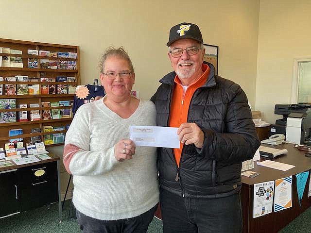 Jay County Visitors and Tourism Bureau recently donated to the Portland Rockets for their 65th year celebration. Pictured above, Jay County Visitors and Tourism Bureau director Mary Adair stands with Randy Fisher of the Portland Rockets. The team’s first “Field of Dreams” game is May 18. (Photo provided)