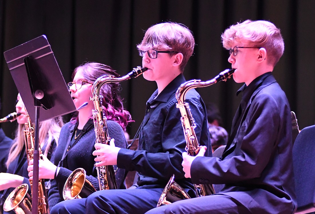 Ayden Teer and Dougie Cox play tenor saxophone Sunday during the Jay County Junior-Senior High School Winter Pops Concert. Pieces performed during the concert included “Skyfall,” selections from “La La Land” and “Crazy for Cartoons.” (The Commercial Review/Ray Cooney)