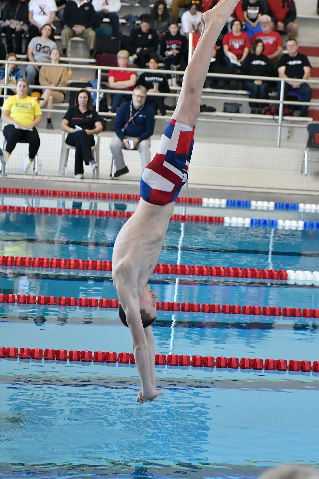 Jay County High School freshman Bryden Carter plunges into the pool during the preliminary round of diving during the sectional meet Saturday. Carter’s fifth-place finish was the highest of any Patriot in the meet. (The Commercial Review/Andrew Balko)