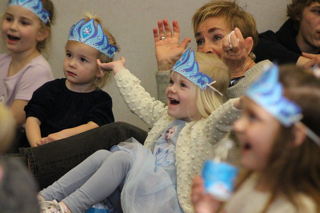 Marin Johnston, 4, sings along with Anna and Elsa during the “Frozen” sing-along party Thursday at Jay County Public Library. Participants received “Frozen” themed beverages, snacks and activities to take home. (The Commercial Review/Bailey Cline)