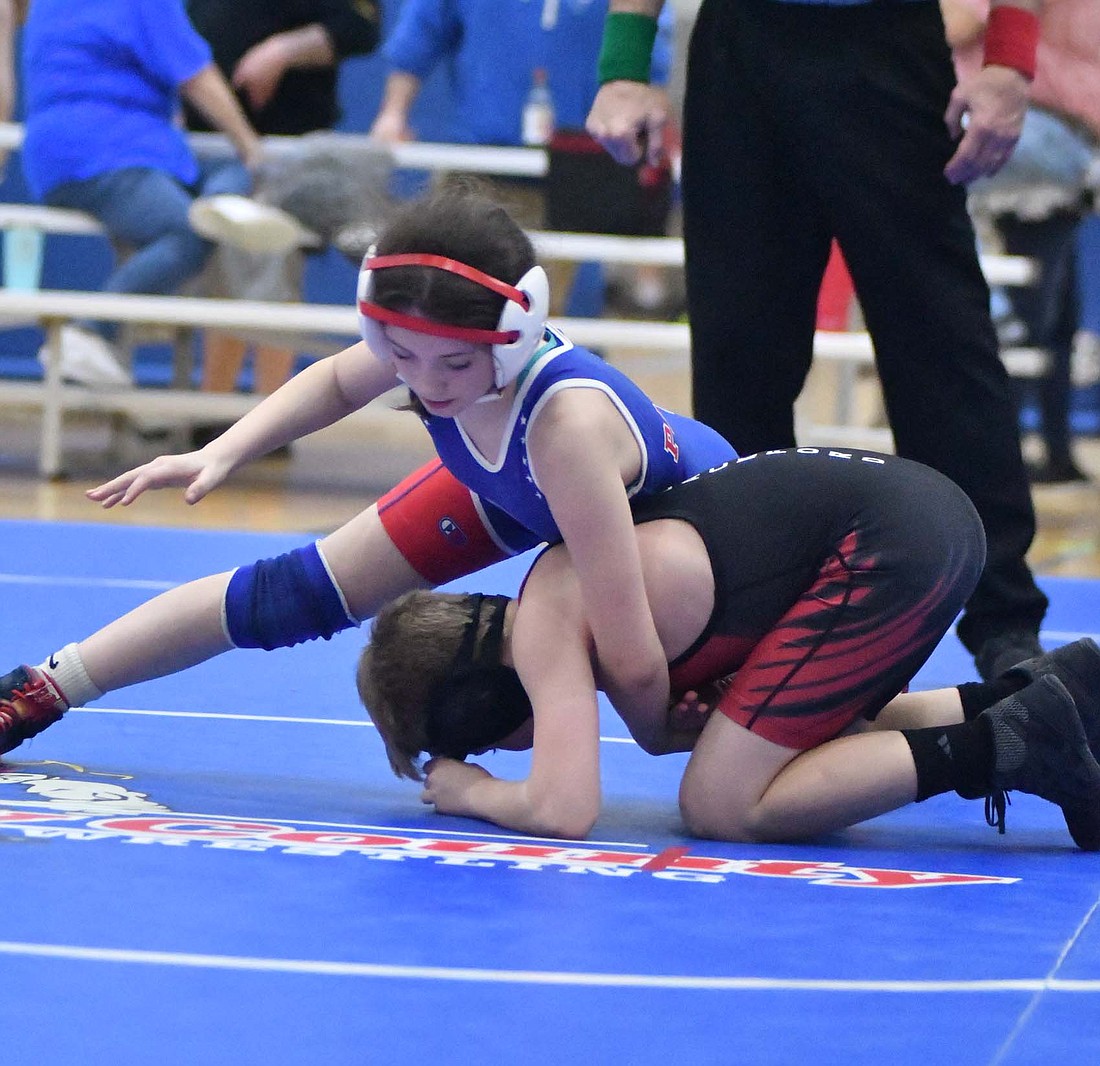 Jay County Junior High School sixth-grader Danica Chowning works to gain control of Blackford’s Carter Bryant in an exhibition match following the Patriots’ 96-24. Chowning secured six points for Jay County as the Bruins had to forfeit the 90-pound contest. (The Commercial Review/Ray Cooney)