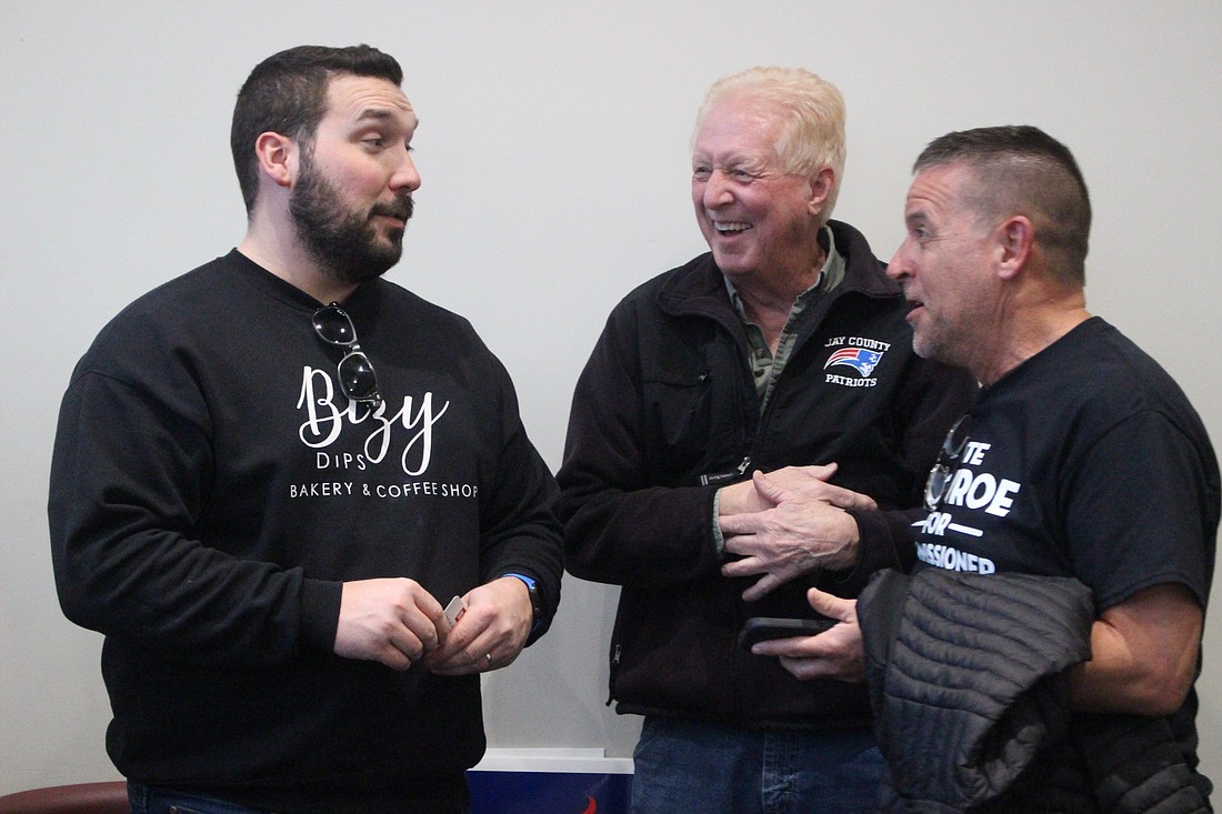 Patrick Long, Ron Laux and Doug Loy chat Thursday at John Jay Center for Learning during the Meet the Republican Candidates event hosted by Jay County Republican Party. (The Commercial Review/Bailey Cline)