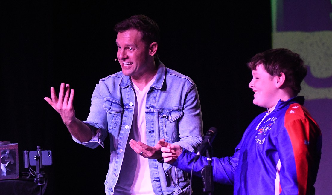Indianapolis Magician Jon Mobley works on a magic trick with audience member Alex Huntsman during his performance Saturday at the Jay County Campus of Arts Place in Portland. Mobley also held a meet and greet with attendees after the show. For more on the magician, visit jonmobley.com. (The Commercial Review/Ray Cooney)