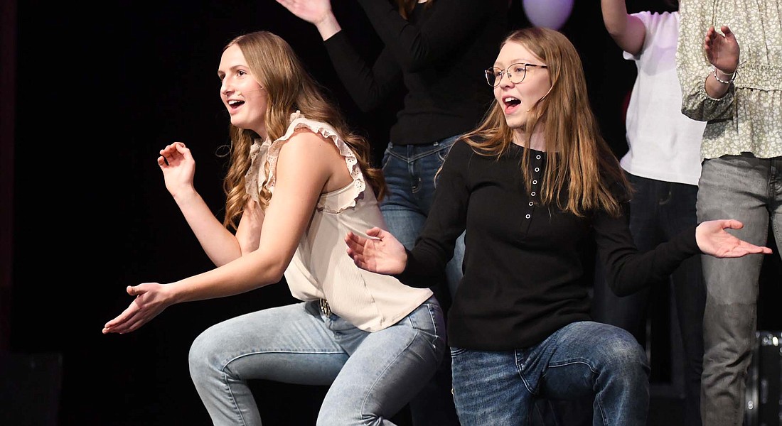 Karlie Niekamp (left) and Olivia Smith perform along with Madison Bihn, Joscie LeFevre, Anna Roessner and Leah Wuebker perform "From Now On" from "The Greatest Showman" during Sunday's Fort Recovery Local Schools Choir Cabaret. Smith, Wuebker and LeFevre later joined Caden Marchal and Trevor Heitkamp for a rendition of "Homeward Bound." (The Commercial Review/Ray Cooney)