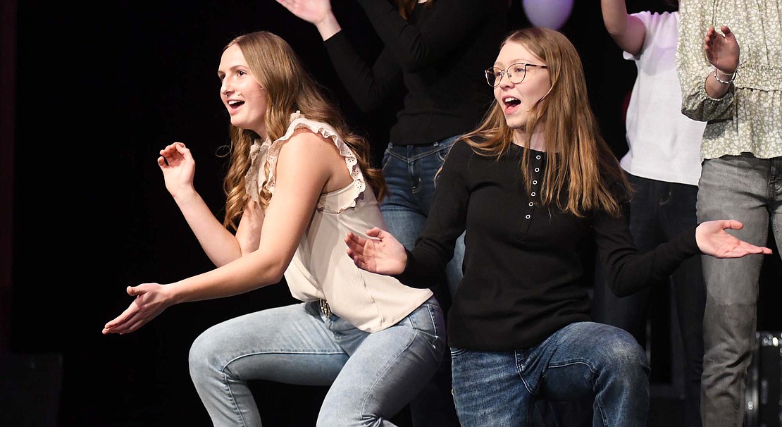 Karlie Niekamp (left) and Olivia Smith perform along with Madison Bihn, Joscie LeFevre, Anna Roessner and Leah Wuebker perform "From Now On" from "The Greatest Showman" during Sunday's Fort Recovery Local Schools Choir Cabaret. Smith, Wuebker and LeFevre later joined Caden Marchal and Trevor Heitkamp for a rendition of "Homeward Bound." (The Commercial Review/Ray Cooney)