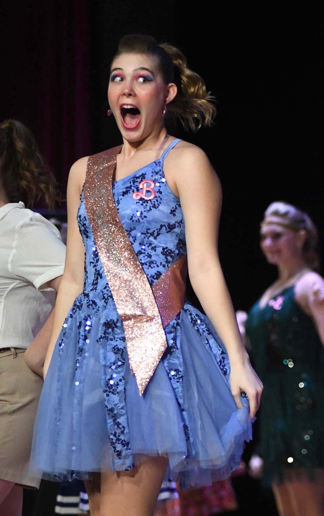 Junior Maddy Snow performs Monday during the Just Treble’s Barbie-themed show during the Jay County High School Show Choir Showcase. Just Treble placed sixth Saturday in the Treble Division at the Bishop Luers Midwest Show Choir Invitational. The group will be back in action this weekend at the Columbia City Cup. For more photos, visit thecr.com.
(The Commercial Review/Ray Cooney)