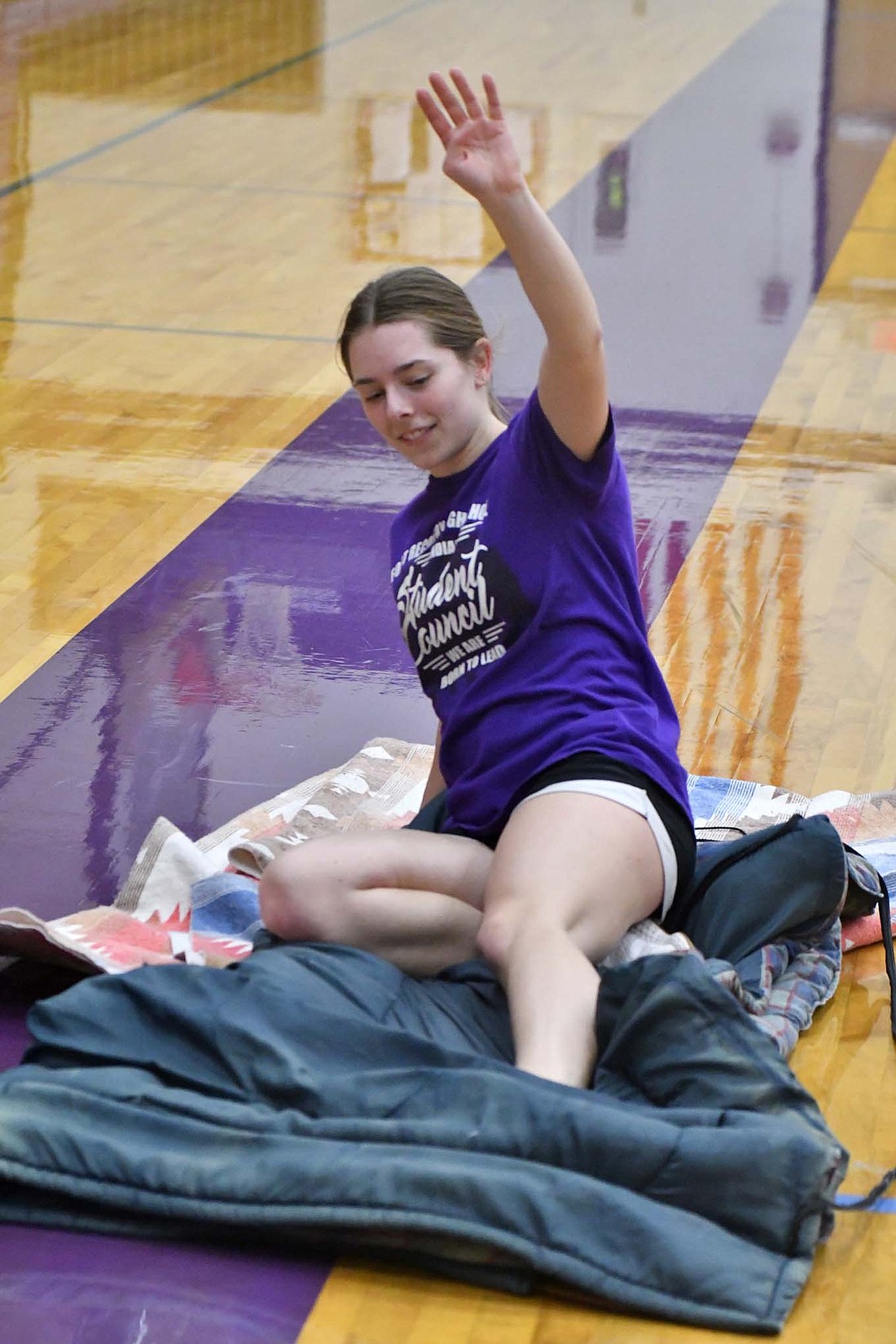 Emma Will, a junior at Fort Recovery High School, slides for a drill Wednesday afternoon during a preseason practice. Inclimate weather kept the Indians from practicing outside, forcing them to utilize the main gym and student activity center. (The Commercial Review/Andrew Balko)