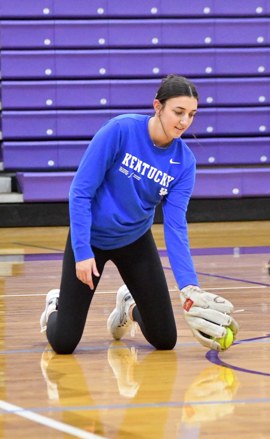 A Fort Recovery High School senior goes through a warmup progression during the softball team’s practice Wednesday afternoon. The Indians open their season March 25 with a home game against Ansonia. (The Commercial Review/Andrew Balko)