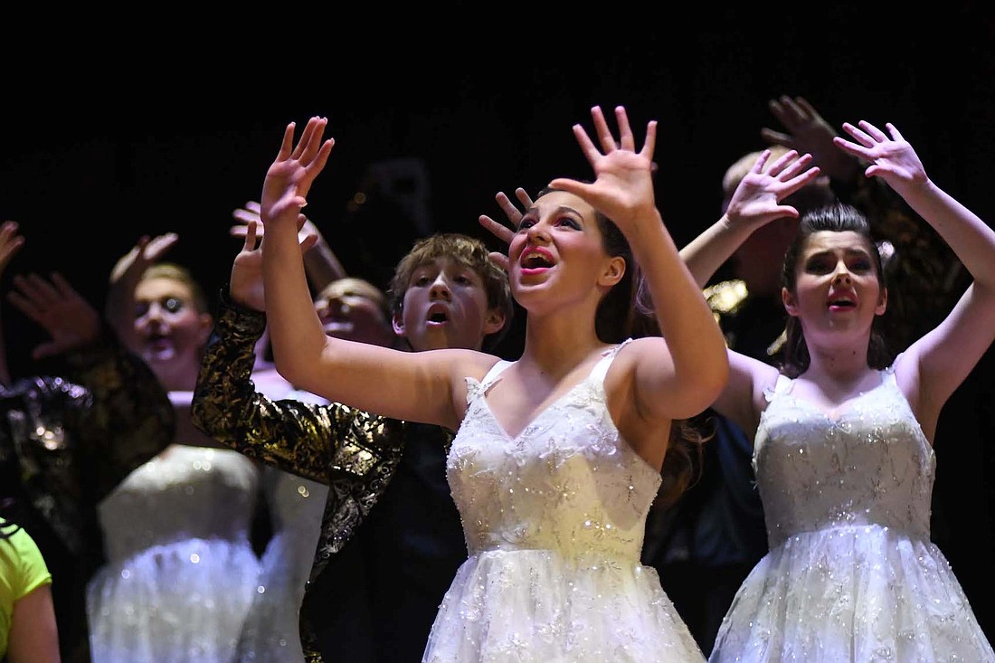 Laila Waddell (center), Skylar Esparza (left) and Inara Sanderson (right) perform Monday as part of Patriot Edition during the Jay County High School Show Choir Showcase. Patriot Edition and Just Treble are competing today in the Columbia City Cup. (The Commercial Review/Ray Cooney)