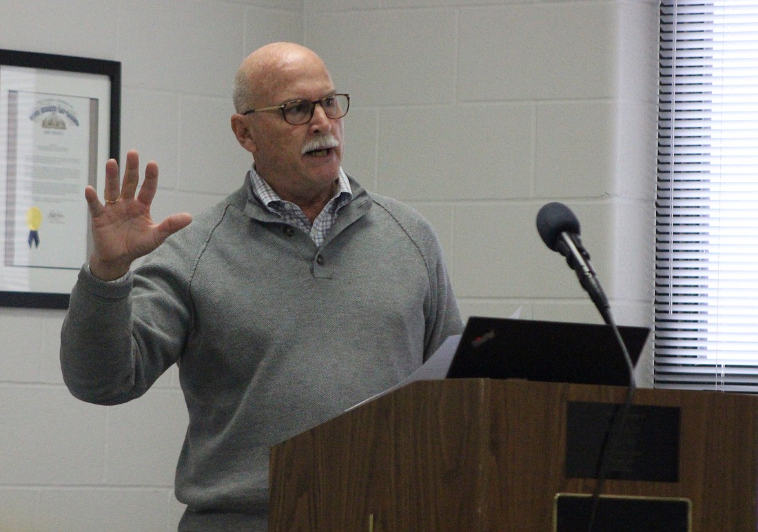 Mercer County auditor Randy Grapner speaks to a small crowd gathered Saturday for the town hall meeting in the community room at Fort Recovery High School. Local residents and officials attended the meeting to discuss recent increases to real estate taxes. (The Commercial Review/Bailey Cline)