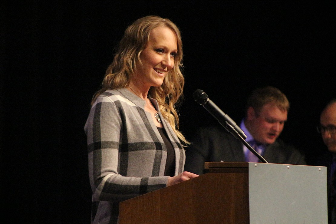 Lisa Overman introduces her friend, Citizen of the Year honoree Megan Wendel, at the Fort Recovery Chamber of Commerce banquet Sunday. (The Commercial Review/Bailey Cline)