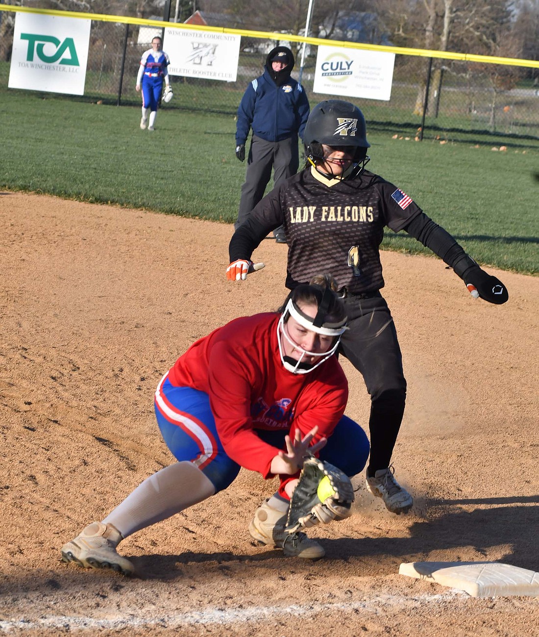 Jozey Shimp snags a throw down from catcher Jaelynn Lykins during the Jay County High School softball team’s scrimmage at Winchester on Tuesday. The Patriots will open their season on April 1 when it travels to take on the Blackford Bruins. (The Commercial Review/Andrew Balko)