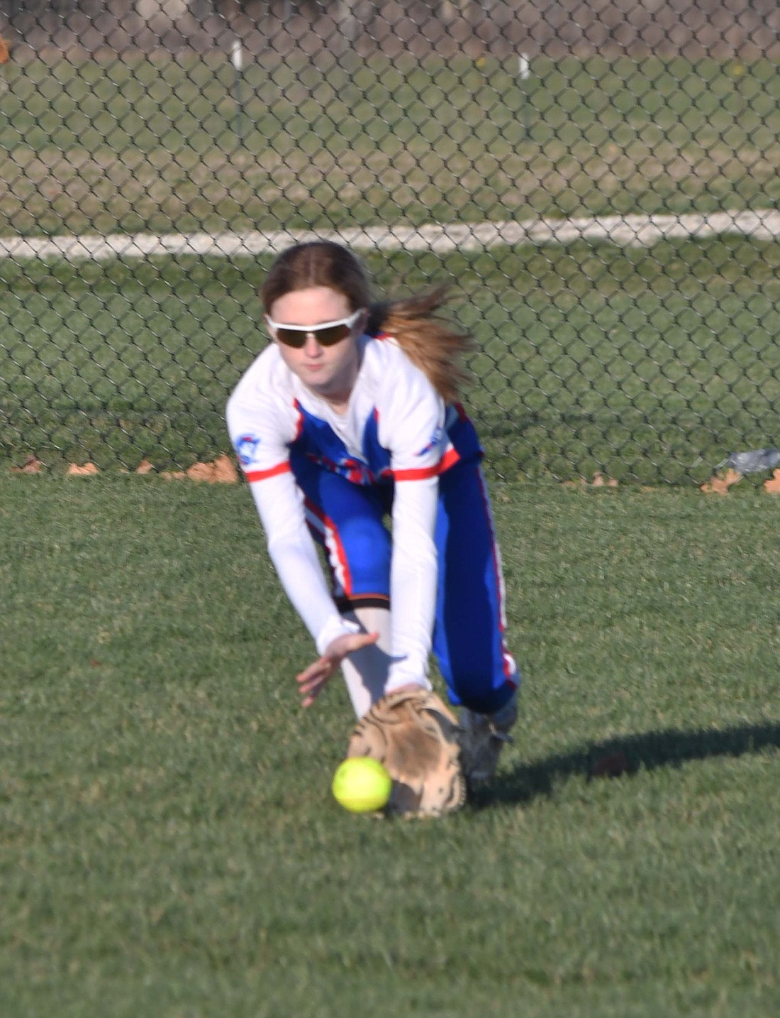 Jay County High School freshman Morgan Missicano charges a ball from right field during the Patriots’ scrimmage at Winchester on Tuesday. Missicano is one of a handful of players coach Doug Arbuckle is looking to slot into the outfield to replace a pair of graduated players. For more on the JCHS softball team, check out the April 3 edition of The Commercial Review. (The Commercial Review/Andrew Balko)