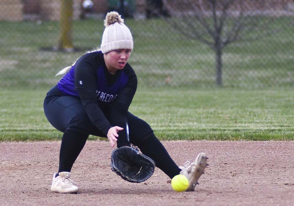 Fort Recovery High School second baseman Ava Grisez makes a stop during the Indian softball team’s scrimmage Friday against Van Wert. The Tribe will open its season at 5 p.m. Monday when it hosts the Ansonia Tigers. (The Commercial Review/Ray Cooney)