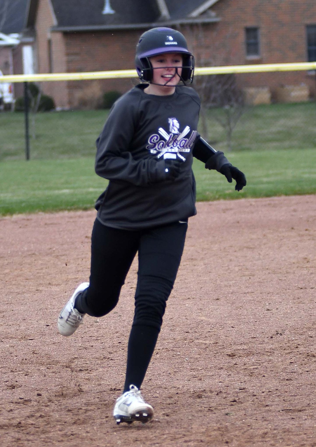 Lily Schwieterman of the Fort Recovery High School softball team heads toward third base on her way to scoring during the first inning of the Indians’ scrimmage Friday against Van Wert. FRHS opened its season Monday against Ansonia. (The Commercial Review/Ray Cooney)