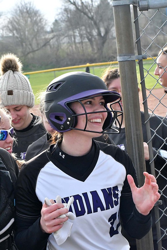 Indians junior Kayla Heitkamp smiles as she returns to the dugout after hitting a home run against Memorial in Thursday’s 5-3 win. Heitkamp’s home run tied the game at 1-1 and provided the Indians with energy. (The Commercial Review/Andrew Balko)