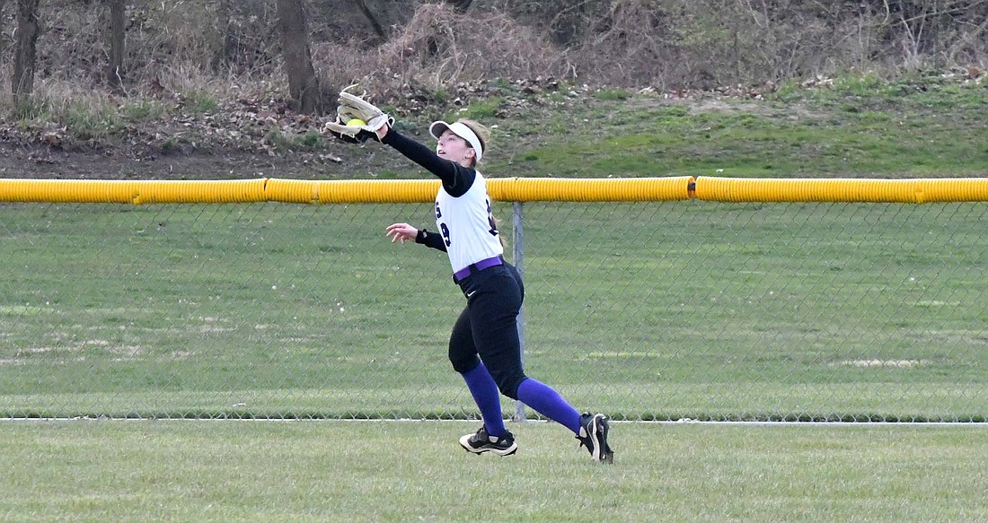 Emma Will reels in a fly ball during the Fort Recovery High School softball team’s 5-3 win at Memorial on Thursday. Will scored three of the runs while reaching base in all four of her plate appearances. (The Commercial Review/Andrew Balko)