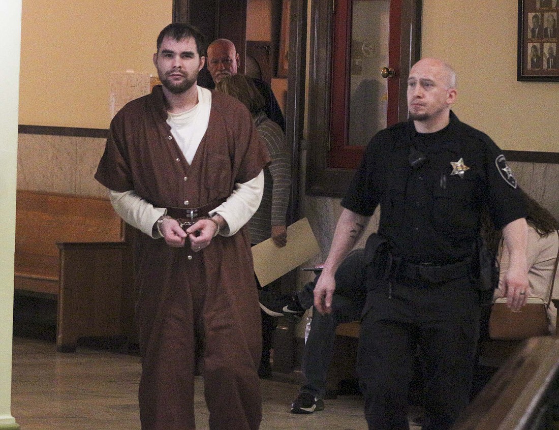 Michael Brown, pictured at left leaving the Jay County Probation Office, was sentenced Wednesday to 11 years in Indiana Department of Correction for causing death while operating a vehicle with a blood alcohol content equivalent to 0.08% or more, a Level 4 felony. The charge stemmed from a June 4 incident, which resulted in the death of 18-year-old Devon Drumm. (The Commercial Review/Bailey Cline)