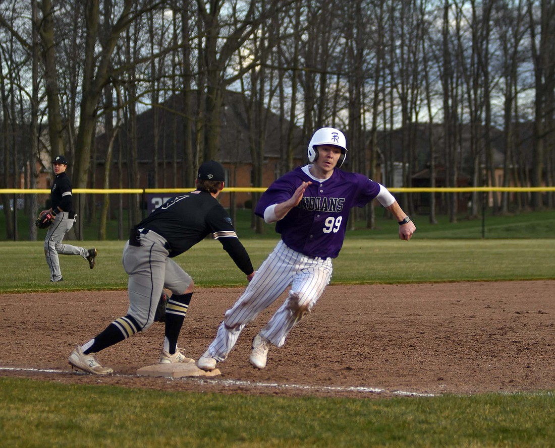 Fort Recovery High School sophomore Reece Wendel rounds third base in the eighth inning of the Indians’ 1-0 win over Parkway on Friday. Wendel hit a double to get into scoring position before Caden Grisez’s line drive drove him in, walking off the Panthers to secure the first Midwest Athletic Conference win for Fort Recovery. (The Commercial Review/Andrew Balko)