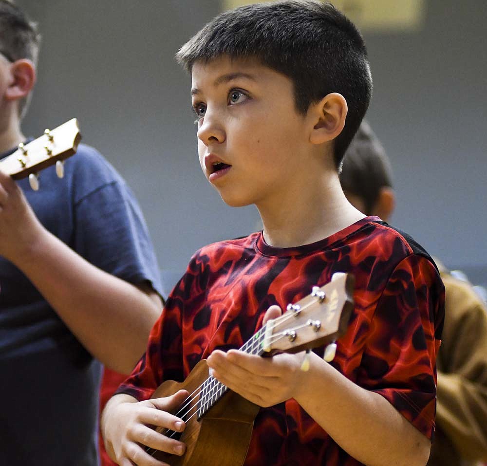 Bloomfield Elementary School fifth grader Kyler Moorehous plays the ukulele Tuesday morning during rehearsal for the school's spring program at East Jay Elementary School. The program, held for the public Tuesday evening, included dancing, singing and percussion numbers as well. (The Commercial Review/Ray Cooney)