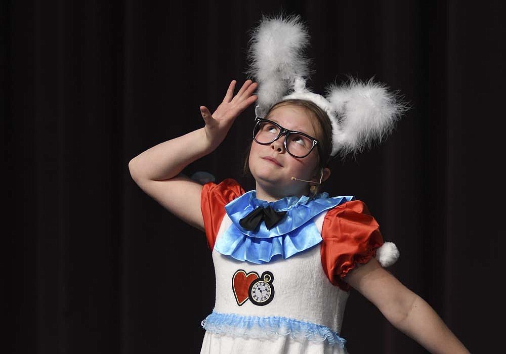 Helena Roessner performs as the White Rabbit during rehearsal Tuesday for the Fort Recovery Elementary/Middle School production of “Dorothy in Wonderland” the musical. Performances are scheduled for 7 p.m. Friday and 2 p.m. Saturday and Sunday. Tickets, which will be available at the door, are $8 for adults and $6 for students, with children younger than 5 admitted free. (The Commercial Review/Ray Cooney)