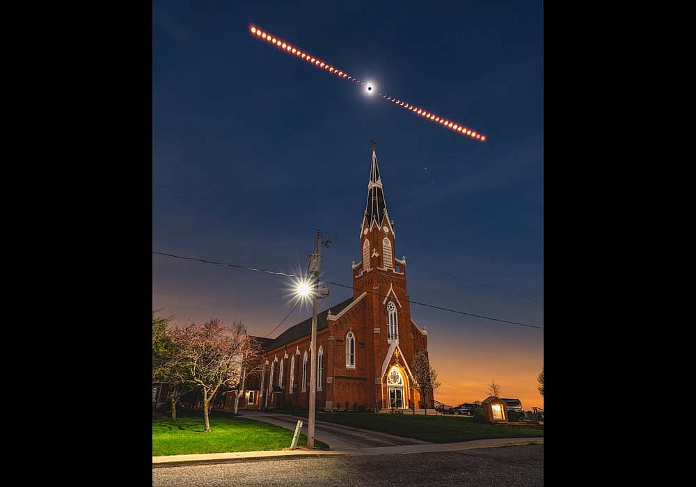 Pittsburgh photographer Dustin McGrew created this image of Monday’s solar eclipse at Church of the Most Holy Trinity in northeast Jay County. McGrew utilized Google Maps to hunt for a new location to shoot the eclipse when the weather forecast indicated cloudy skies in northwest Pennsylvania. “Two or three days out from the eclipse it looked like the best place was going to be Indiana or western Ohio,” said McGrew. (Dustin McGrew Photography)